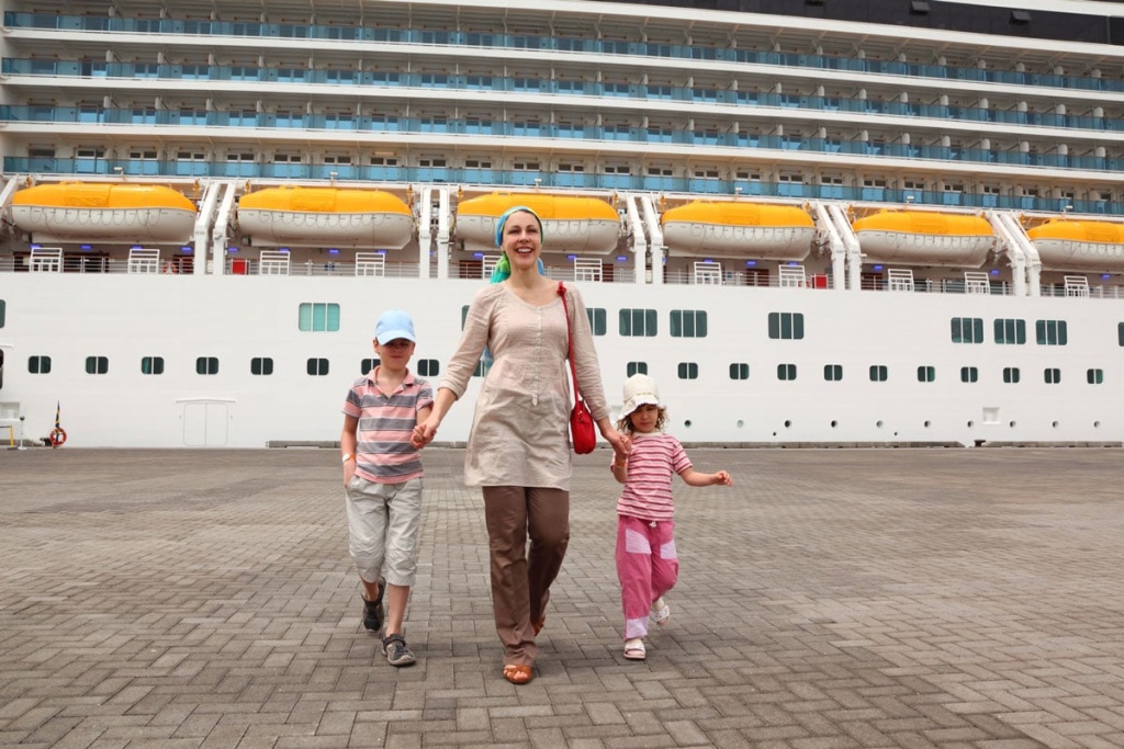 mother daughter and son walking in dock